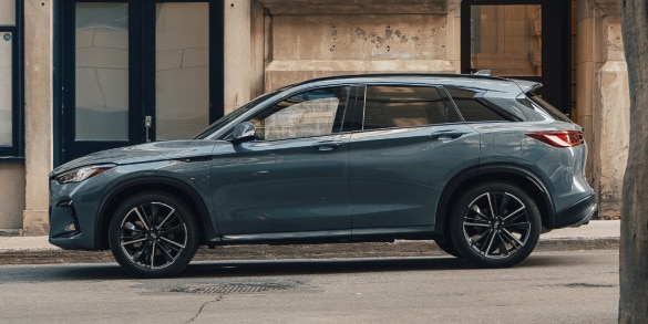 Side profile of a parked 2024 INFINITI QX50 crossover SUV 