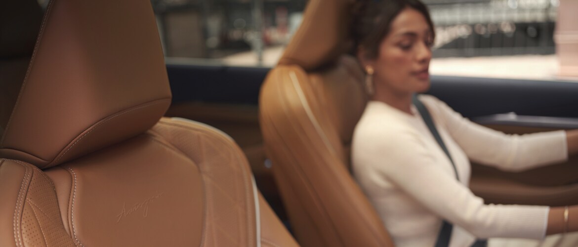Woman driving luxury Infiniti vehicle