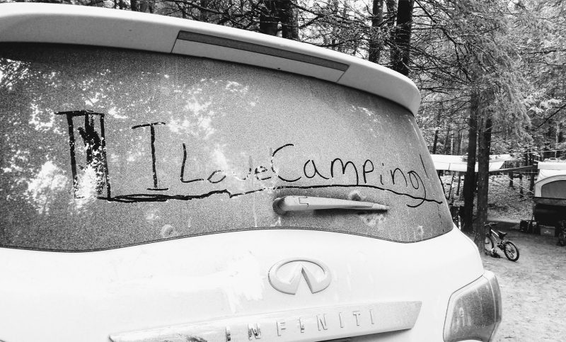 I love camping - is written by finger on the rear windshield of the INFINITI QX80 SUV.