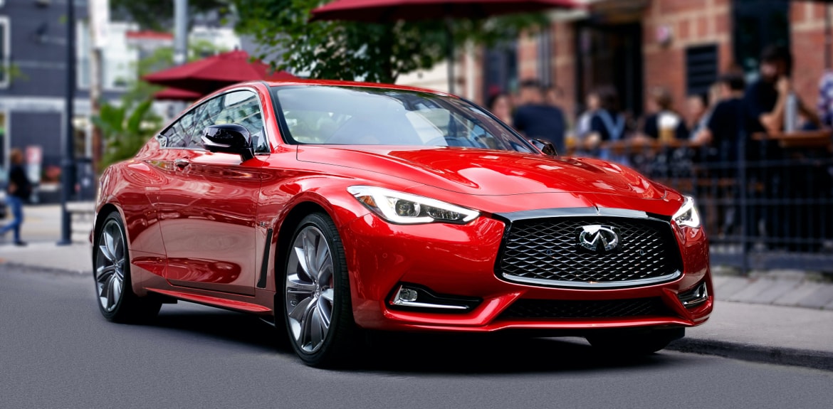 Desktop 1920 x 1080 wallpaper image of the side of a red Q60 Sport Coupe parked on street.