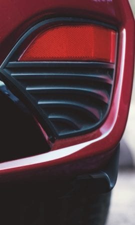 Mobile 428 x 926 wallpaper image of a red Q60 Sport Coupe's tail light.