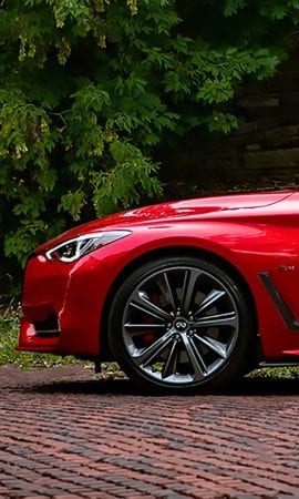 Mobile 428 x 926 wallpaper image of the front left wheel and lights of a red Q60 Sport Coupe.