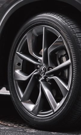 Mobile 428 x 926 wallpaper image of a QX50 Luxury Crossover's tire.