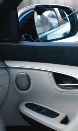 Mobile 428 x 926 wallpaper image of a QX50 Luxury Crossover's interior and front right side mirror.