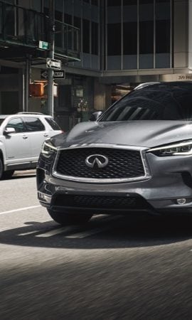 Mobile 428 x 926 wallpaper image of a QX50 Luxury Crossover's grill and front headlights.