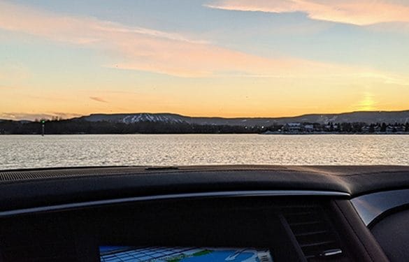 A sunset view taken from inside an INFINITI QX80 SUV.