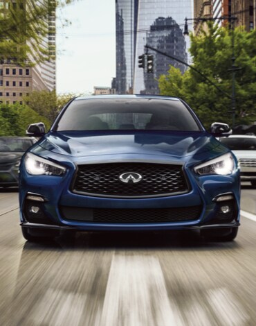 Front profile view of 2023 INFINITI Q50 exterior highlighting grille and hood design