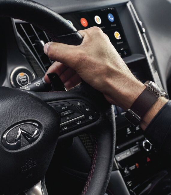 Interior close up of 2023 INFINITI Q50 steering wheel