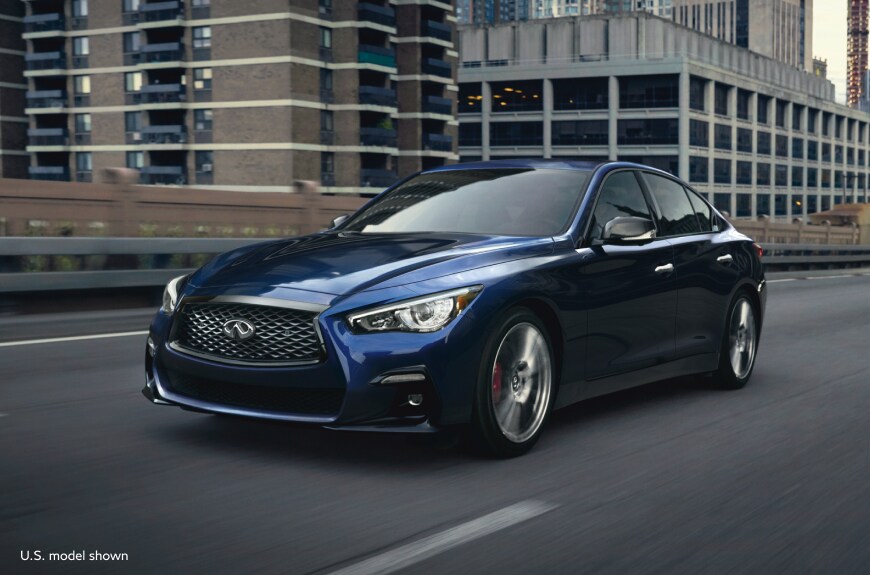 2023 INFINITI Q50 Luxury Sedan driving on the road. U.S. model shown, Model may not be exactly as shown.