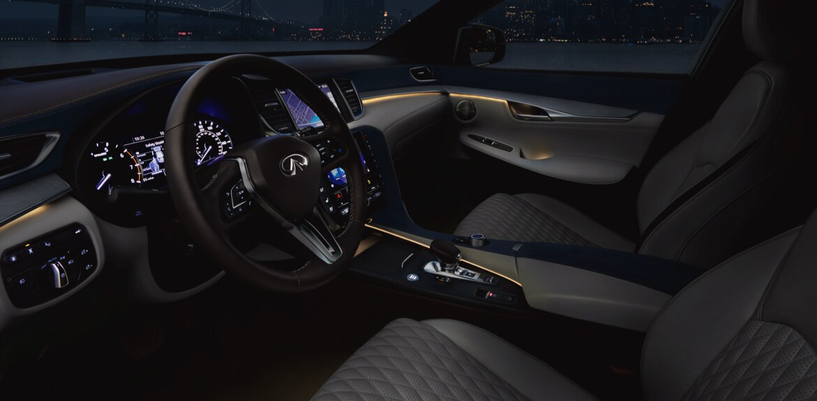 Driver and passenger view of the Black and beige interior in the 2022 INFINITI QX50 crossover