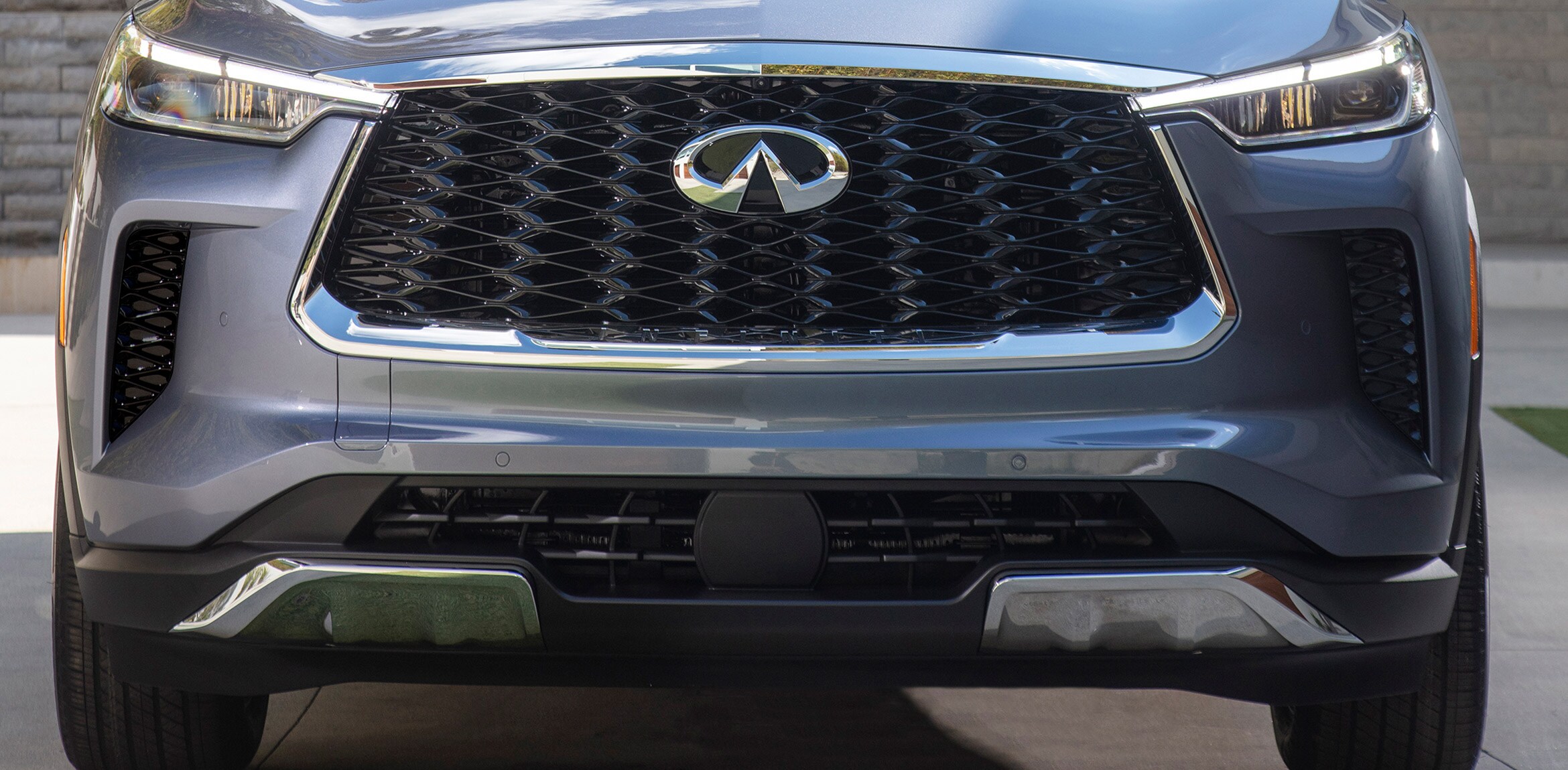 Rear exterior view of 2022 INFINITI QX60 Crossover SUV highlighting LED taillights