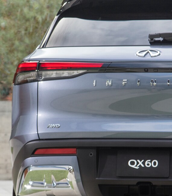 Rear exterior close up of 2022 INFINITI QX60's Intelligent AWD badge