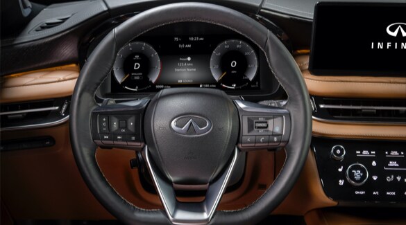 Close up of 2022 INFINITI QX60 interior highlighting QX60's steering wheel