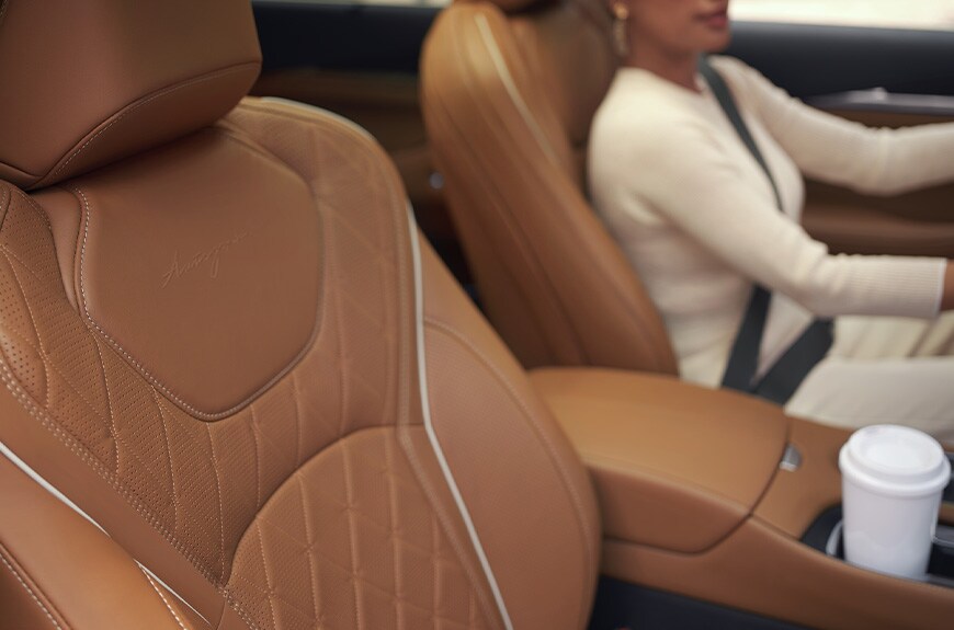 Interior view of woman driving 2022 INFINITI QX60 Crossover SUV