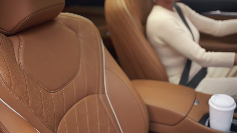 Interior view of woman driving 2024 INFINITI QX60 Crossover SUV