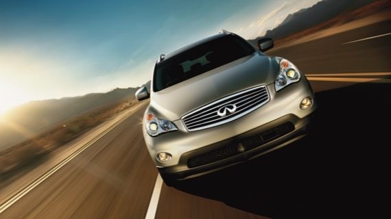 A front view of the INFINITI EX35 driving down the highway