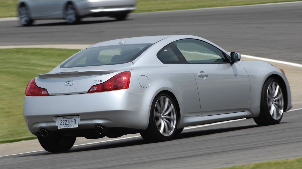 Rear profile of a silver INFINITI G37 S on the track