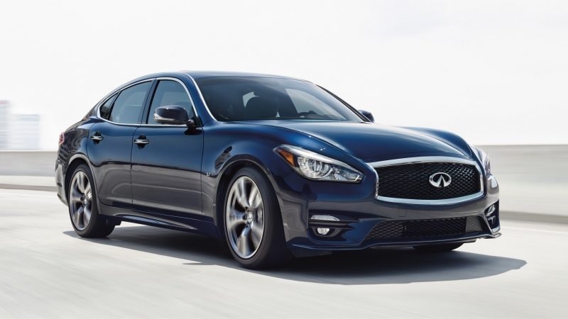Front profile of a 2019 INFINITI Q70 sedan driving fast on the road