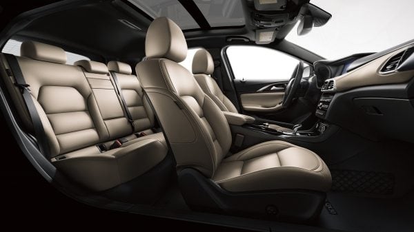 The luxurious tan leather interior of the INFINITI QX30