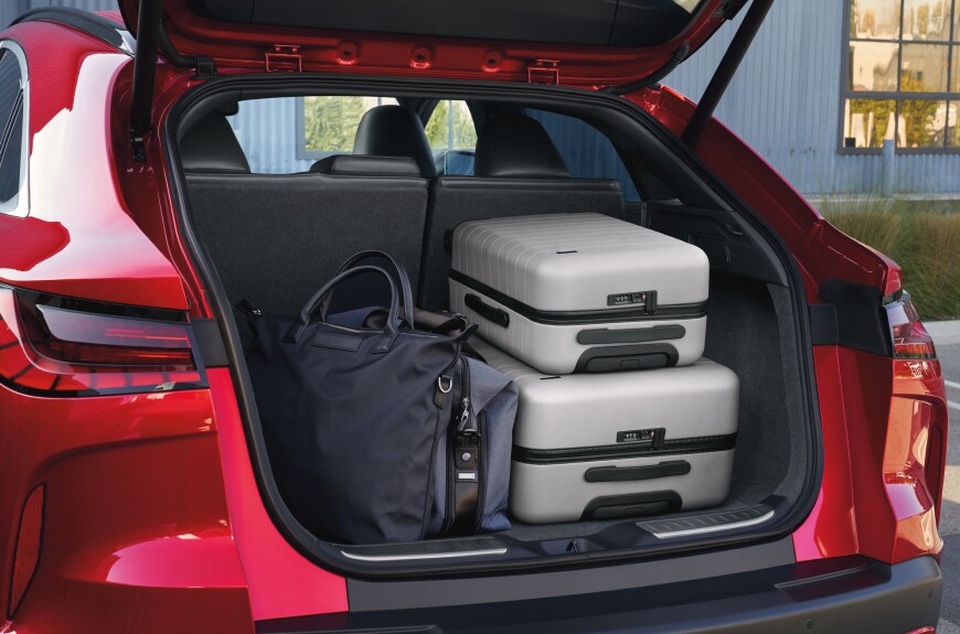 2023 INFINITI QX55 cargo space loaded with three pieces of luggage