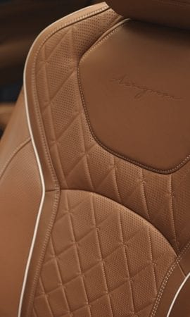 Mobile 428 x 926 wallpaper image of a QX60 Mid-Size Luxury SUV 's seat upholstery.