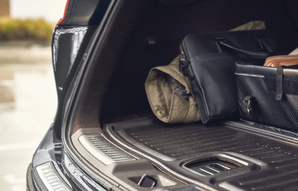 An open trunk of an INFINITI SUV showing the spacious rear cargo capacity